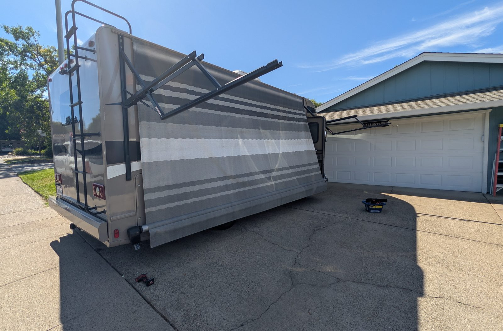 Extended RV awning being inspected at a customer's location