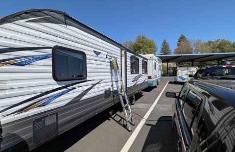 Travel trailer service at storage lot