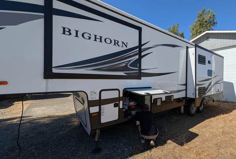 Fifth wheel RV storage compartment service